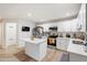 Bright, updated kitchen with white cabinets, modern appliances, and a central island, perfect for cooking at 2528 N 22Nd Dr, Phoenix, AZ 85009