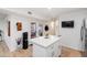 Bright kitchen with a large center island, modern appliances and white cabinets at 2528 N 22Nd Dr, Phoenix, AZ 85009