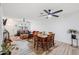 Open floor plan with living room and dining area, featuring wood tile flooring and modern furniture at 2528 N 22Nd Dr, Phoenix, AZ 85009