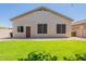 A low maintenance backyard has a grassy area, gravel and artificial turf at 25860 N 47Th Pl, Phoenix, AZ 85050