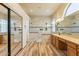 Luxurious bathroom featuring double showers, double vanities and modern tile work at 25860 N 47Th Pl, Phoenix, AZ 85050