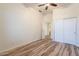 Bedroom featuring wood-look floors, closet and white doors, flooded with natural light at 25860 N 47Th Pl, Phoenix, AZ 85050
