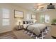 Serene bedroom featuring a cozy bed, soft lighting, and coordinated decor for a relaxing retreat at 25860 N 47Th Pl, Phoenix, AZ 85050