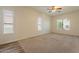 Bedroom with carpet, three windows with blinds, and a ceiling fan at 25860 N 47Th Pl, Phoenix, AZ 85050
