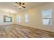 Bright living space with three large windows providing abundant natural light at 25860 N 47Th Pl, Phoenix, AZ 85050
