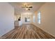 Expansive living room showcasing wood-look floors, neutral walls, and natural light at 25860 N 47Th Pl, Phoenix, AZ 85050