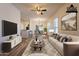 Open-concept living area with modern furnishings, a dining area, and stylish decor creates a perfect living space at 25860 N 47Th Pl, Phoenix, AZ 85050