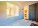 An enclosed patio has tile floors, window and slider views into the dining room and kitchen at 25860 N 47Th Pl, Phoenix, AZ 85050