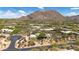 Desert home with desert landscaping, sprawling community and mountain views from above at 26049 N 104Th Pl, Scottsdale, AZ 85255