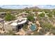Desert home displaying its landscaping, pool and patio, as well as community setting at 26049 N 104Th Pl, Scottsdale, AZ 85255