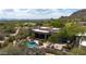 Stunning aerial view of the home with a private pool, landscaped yard, and scenic desert mountain views at 26049 N 104Th Pl, Scottsdale, AZ 85255