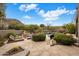 Beautiful backyard oasis with a pool, spa, waterfall feature, and lush landscaping, creating a serene retreat at 26049 N 104Th Pl, Scottsdale, AZ 85255