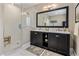Modern bathroom boasts dual sink vanity, marble counters, and glass shower at 26049 N 104Th Pl, Scottsdale, AZ 85255