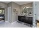 Bathroom with double vanity, ample storage, and walk-in shower at 26049 N 104Th Pl, Scottsdale, AZ 85255