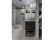 Modern bathroom featuring a walk-in shower with decorative tile and a sleek vanity with storage at 26049 N 104Th Pl, Scottsdale, AZ 85255