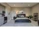 Comfortable bedroom with a kitchenette, modern decor, and a view of outdoor scenery at 26049 N 104Th Pl, Scottsdale, AZ 85255