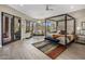 Spacious bedroom features four-poster bed, sitting area with mountain views at 26049 N 104Th Pl, Scottsdale, AZ 85255