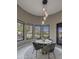 Charming breakfast nook with beautiful views, a stylish light fixture, and a cozy seating arrangement at 26049 N 104Th Pl, Scottsdale, AZ 85255