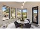 Breakfast nook with views of the landscaped backyard and water feature at 26049 N 104Th Pl, Scottsdale, AZ 85255