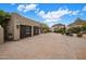 Lovely home featuring a spacious driveway and two-car garage at 26049 N 104Th Pl, Scottsdale, AZ 85255