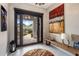 Home entryway with views to the desert, large glass doors, and tile flooring at 26049 N 104Th Pl, Scottsdale, AZ 85255