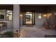 Inviting front entrance with a stone patio, stylish decor, and a glimpse into the home's interior at 26049 N 104Th Pl, Scottsdale, AZ 85255