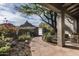 Beautiful desert home entrance with stone path, lush vegetation, and mountain views at 26049 N 104Th Pl, Scottsdale, AZ 85255