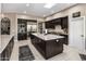 Spacious kitchen with stainless steel appliances, central island, and plenty of storage at 26049 N 104Th Pl, Scottsdale, AZ 85255