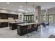 Spacious, modern kitchen with pendant lighting, dual islands, and breakfast nook at 26049 N 104Th Pl, Scottsdale, AZ 85255