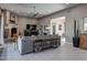 Spacious living room with neutral tones, a fireplace, and an open layout perfect for entertaining guests at 26049 N 104Th Pl, Scottsdale, AZ 85255