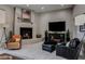 Cozy living room featuring a fireplace, comfortable seating, and stylish decor for a relaxing ambiance at 26049 N 104Th Pl, Scottsdale, AZ 85255