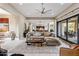 Open-concept living room seamlessly connects to dining and outdoor spaces at 26049 N 104Th Pl, Scottsdale, AZ 85255