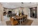 Open dining and living room floorplan with modern décor and luxury finishes at 26049 N 104Th Pl, Scottsdale, AZ 85255