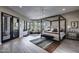 Bright primary suite with sitting area, floor-to-ceiling windows, and natural light at 26049 N 104Th Pl, Scottsdale, AZ 85255