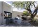 Outdoor kitchen with built-in grill and prep space, surrounded by lush landscaping at 26049 N 104Th Pl, Scottsdale, AZ 85255