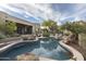 Beautiful backyard pool with mature trees and outdoor seating area at 26049 N 104Th Pl, Scottsdale, AZ 85255