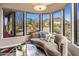 Cozy sitting area with desert views offers a serene retreat with views of an outdoor pool and landscaping at 26049 N 104Th Pl, Scottsdale, AZ 85255