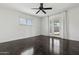 Bright bedroom features a ceiling fan, a window, and access to the backyard at 2740 N 21St Dr, Phoenix, AZ 85009