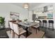 Well-designed dining area featuring a modern table, seating for eight, and an adjacent kitchen at 2740 N 21St Dr, Phoenix, AZ 85009