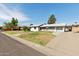 Traditional single-story home with a well-manicured front lawn and attached garage at 2740 N 21St Dr, Phoenix, AZ 85009
