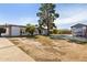 Charming home featuring a spacious front yard, carport, and separate garage at 2740 N 21St Dr, Phoenix, AZ 85009