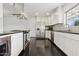 Modern kitchen with stainless steel appliances, sleek white cabinetry, and stylish backsplash at 2740 N 21St Dr, Phoenix, AZ 85009
