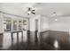 Spacious living area with polished concrete floors, large windows, and sliding glass doors to the patio at 2740 N 21St Dr, Phoenix, AZ 85009