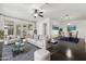 Bright living room featuring modern decor, comfortable seating, and an adjacent dining area, perfect for entertaining at 2740 N 21St Dr, Phoenix, AZ 85009