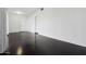 Spacious living room with ample light, neutral walls and dark floors at 2740 N 21St Dr, Phoenix, AZ 85009