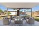 Outdoor seating area with comfortable furniture, a shaded patio, and a view of the backyard at 2740 N 21St Dr, Phoenix, AZ 85009