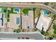 A sunny aerial view of a single-Gathering home and manicured landscaping, as seen from above at 30909 N 27Th Ave, Phoenix, AZ 85085
