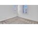 Bright bedroom with white trim, neutral decor, and window shutters at 30909 N 27Th Ave, Phoenix, AZ 85085