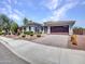 Desirable single-story house featuring drought resistant landscaping, a two-car garage and walkway at 30909 N 27Th Ave, Phoenix, AZ 85085