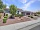 Inviting single-story home with drought resistant landscaping, paved walkway, and attached garage at 30909 N 27Th Ave, Phoenix, AZ 85085